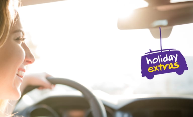 Smiling woman driving a car